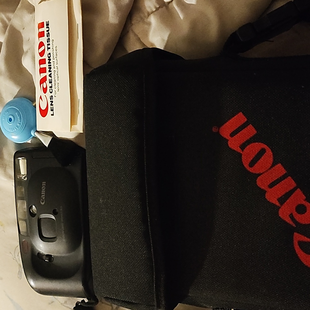 Vintage Canon camera and Canon bag with brush cleaner